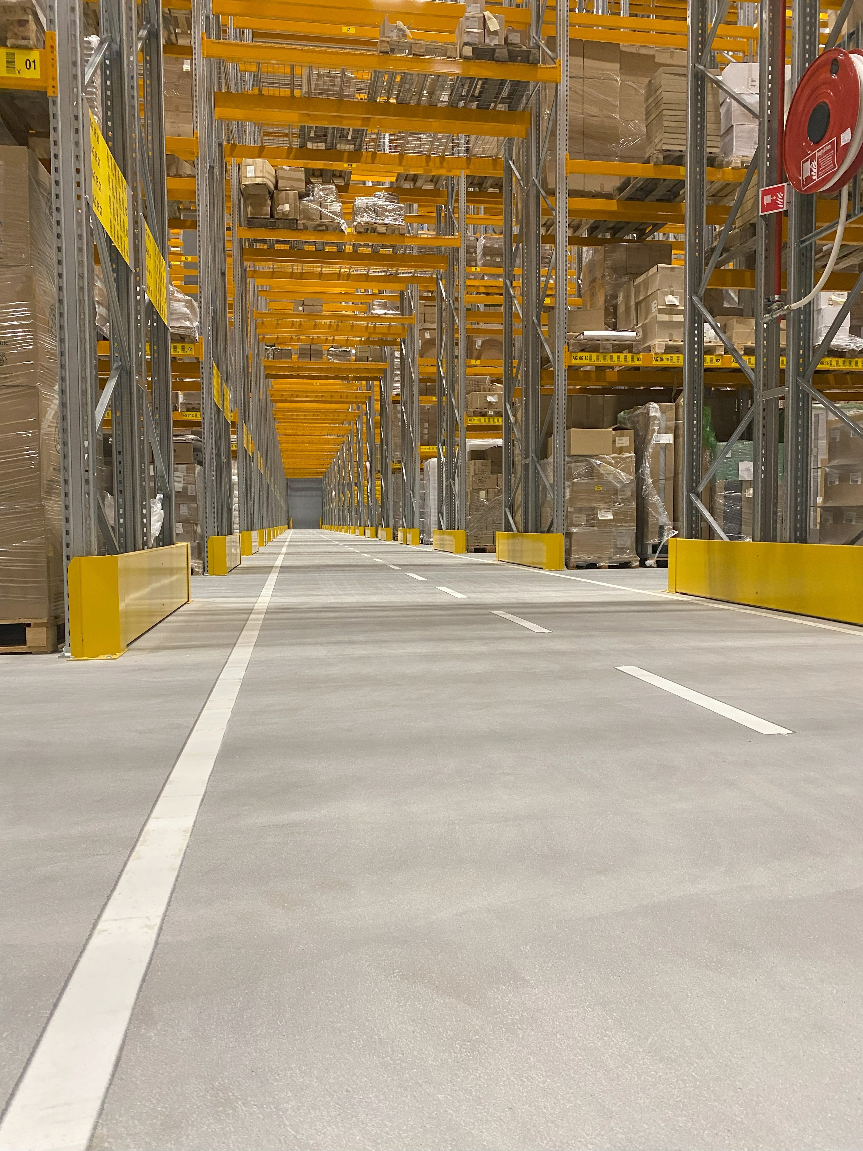 Finished joint-free flooring in warehouse. mezzanine, joint free roller compacted concrete floors 