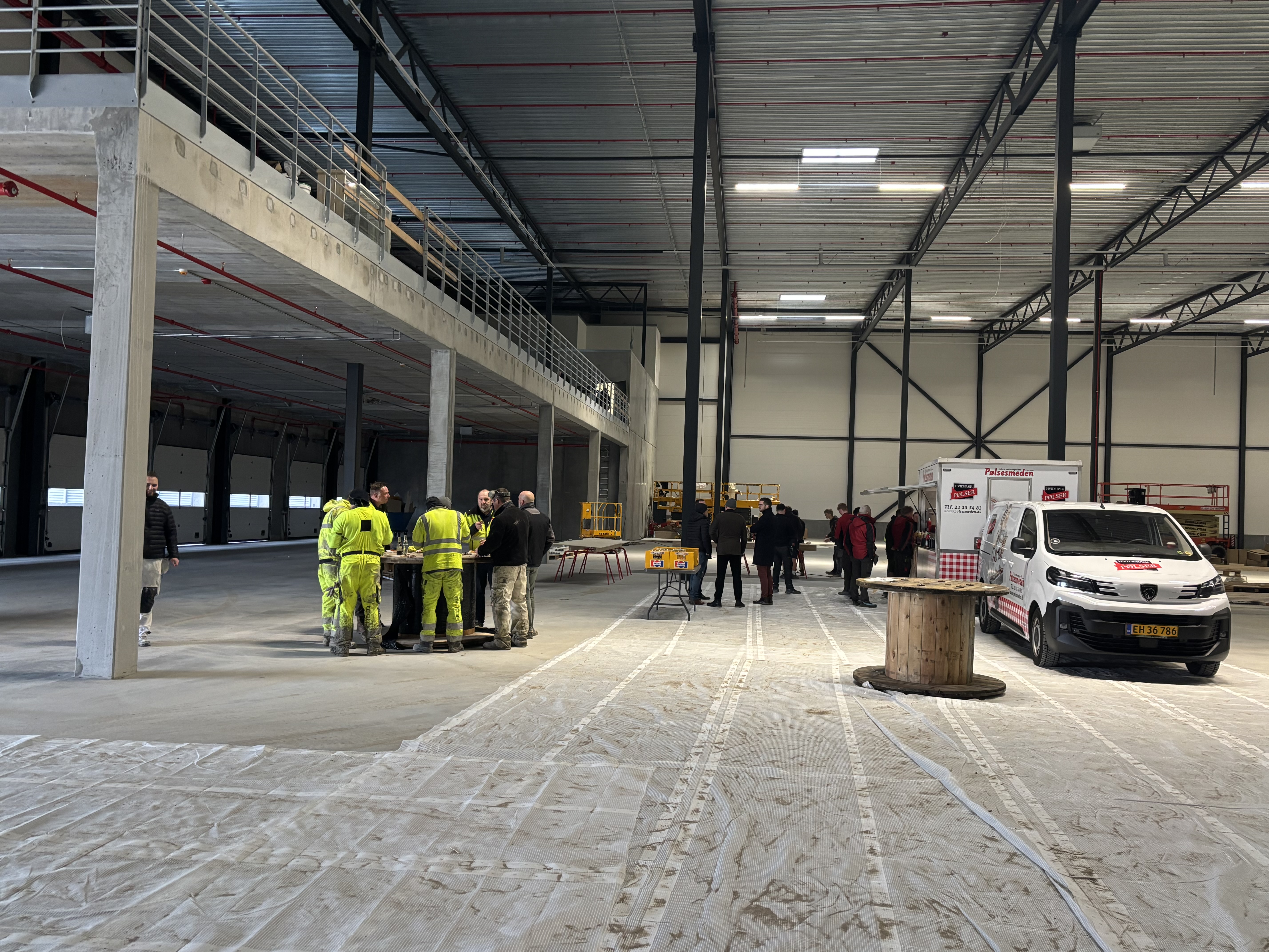 Finished concrete flooring in warehouse facilities. base and wear layer. high-bay warehouse. Narrow aisle warehouse. 